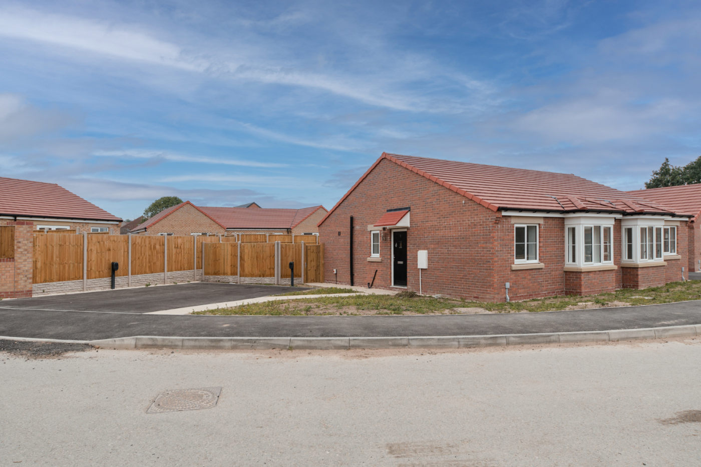 Front of a semi detached bungalow with parking on a corner