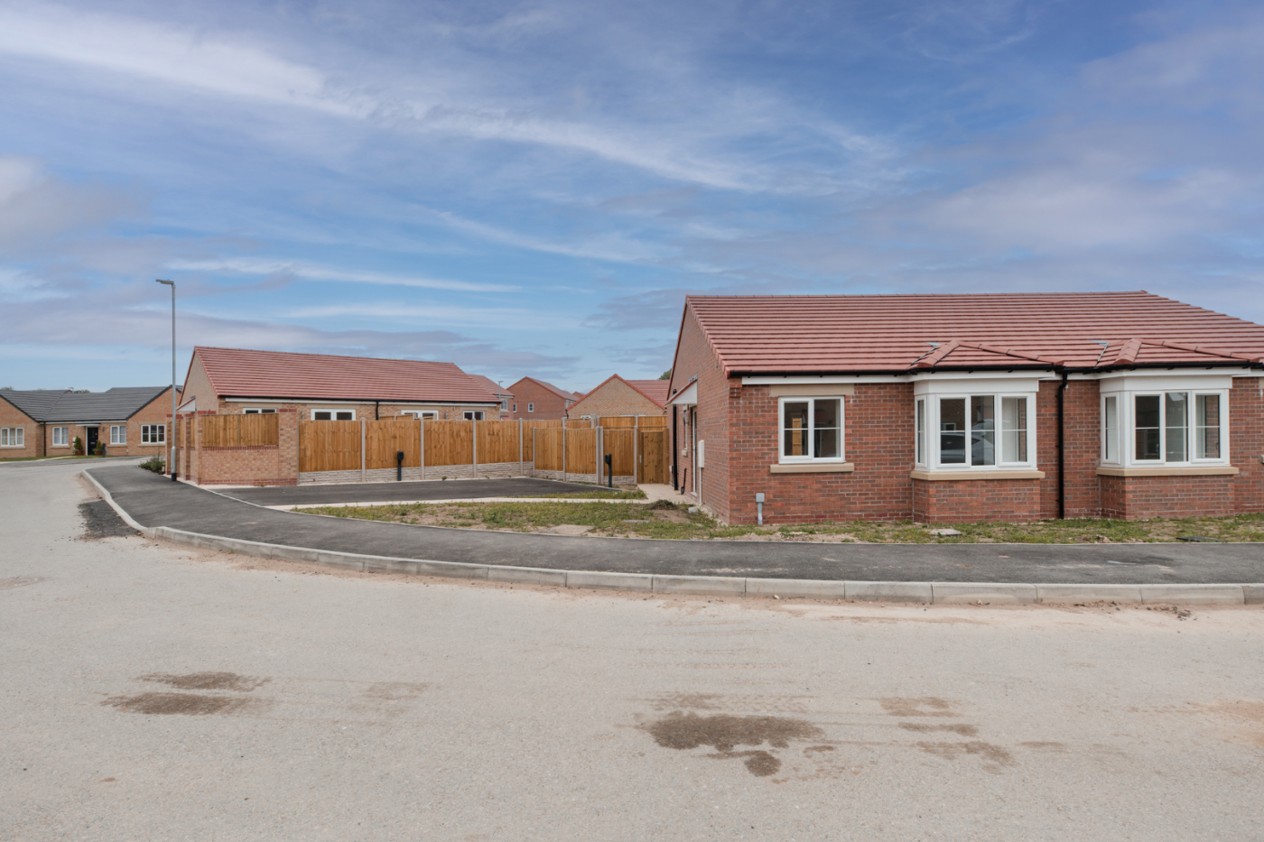 Front of a semi detached bungalow with parking on a corner