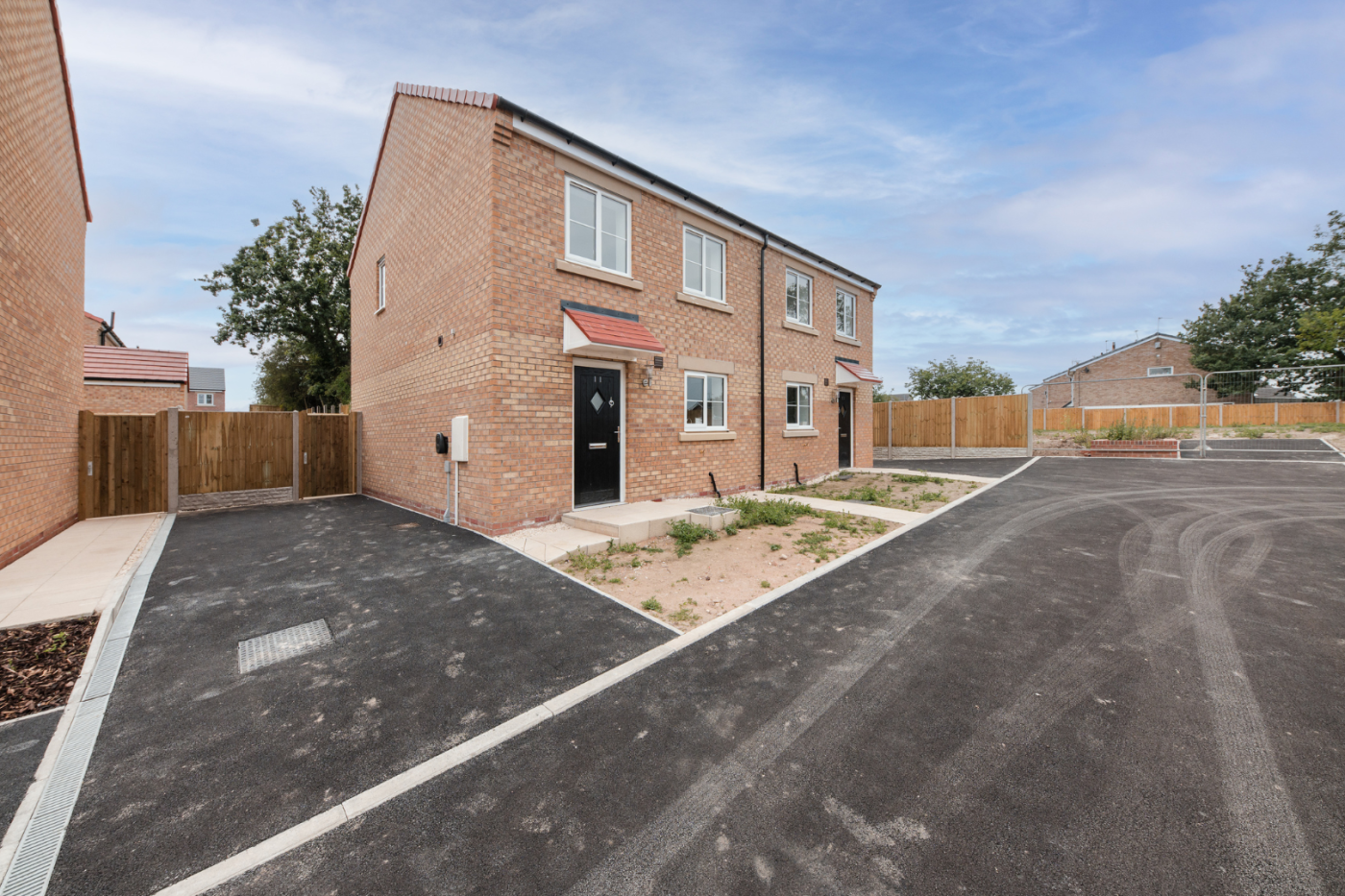 Front of a semi detached house with a driveway