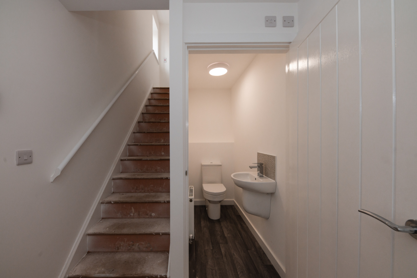 Hallway with stairs and downstairs WC