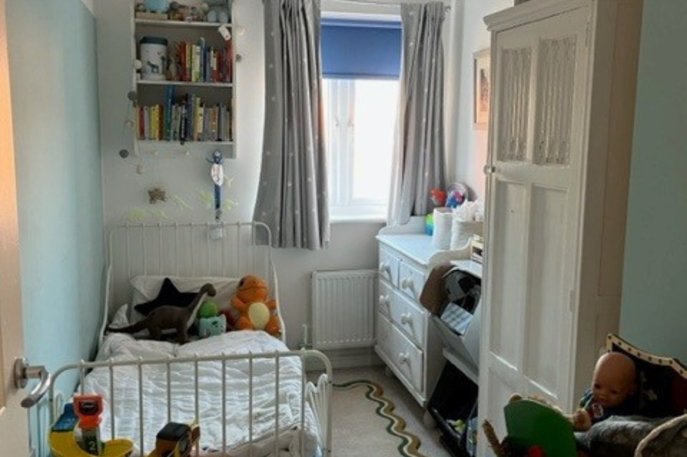 Bedroom with a single bed, chest of drawers and wardrobe