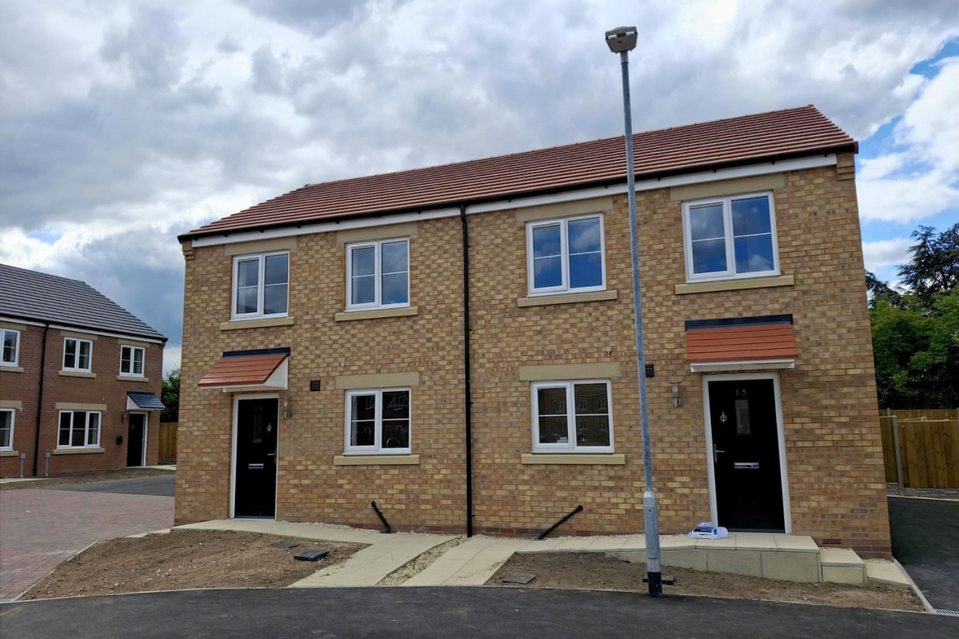 The front of a semi-detached house on a housing estate