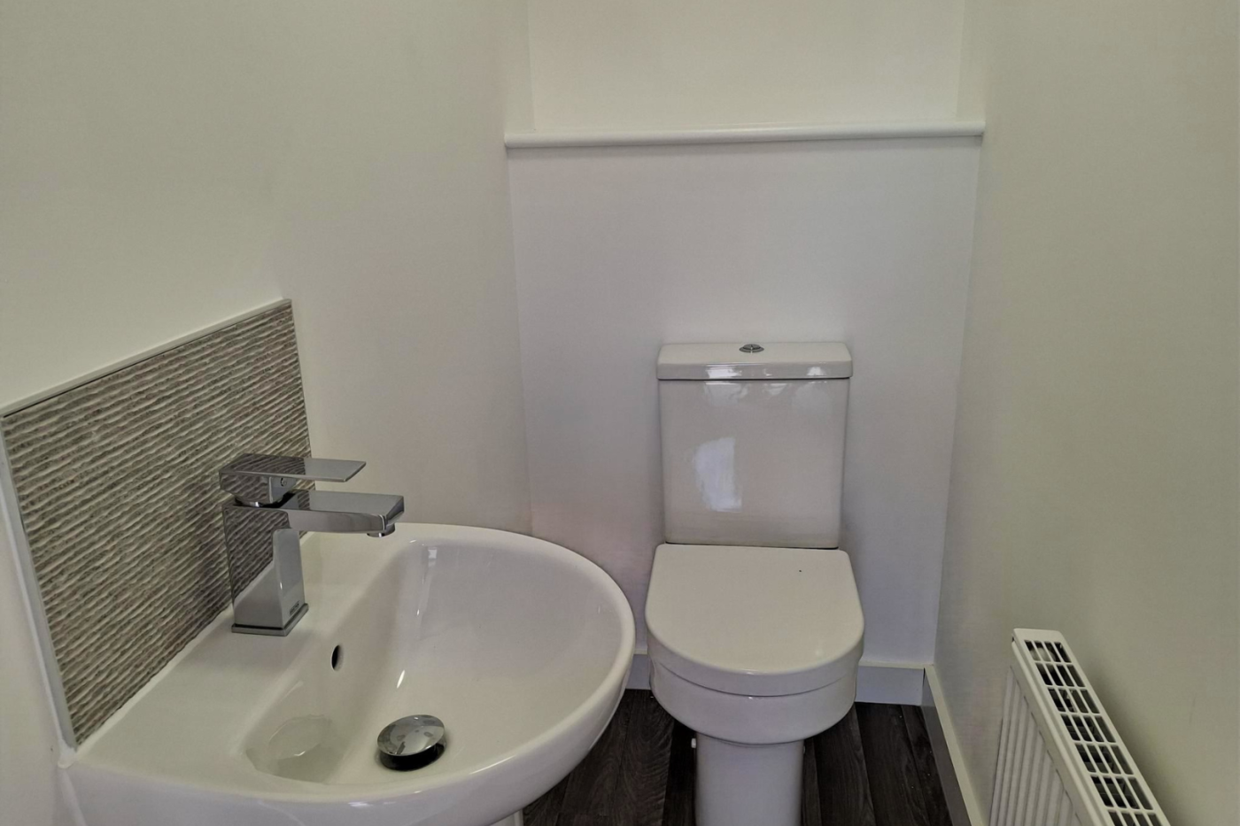 The downstairs water closet showing sink and toilet