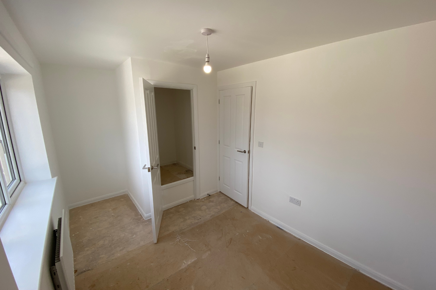 Empty bedroom space with cupboard