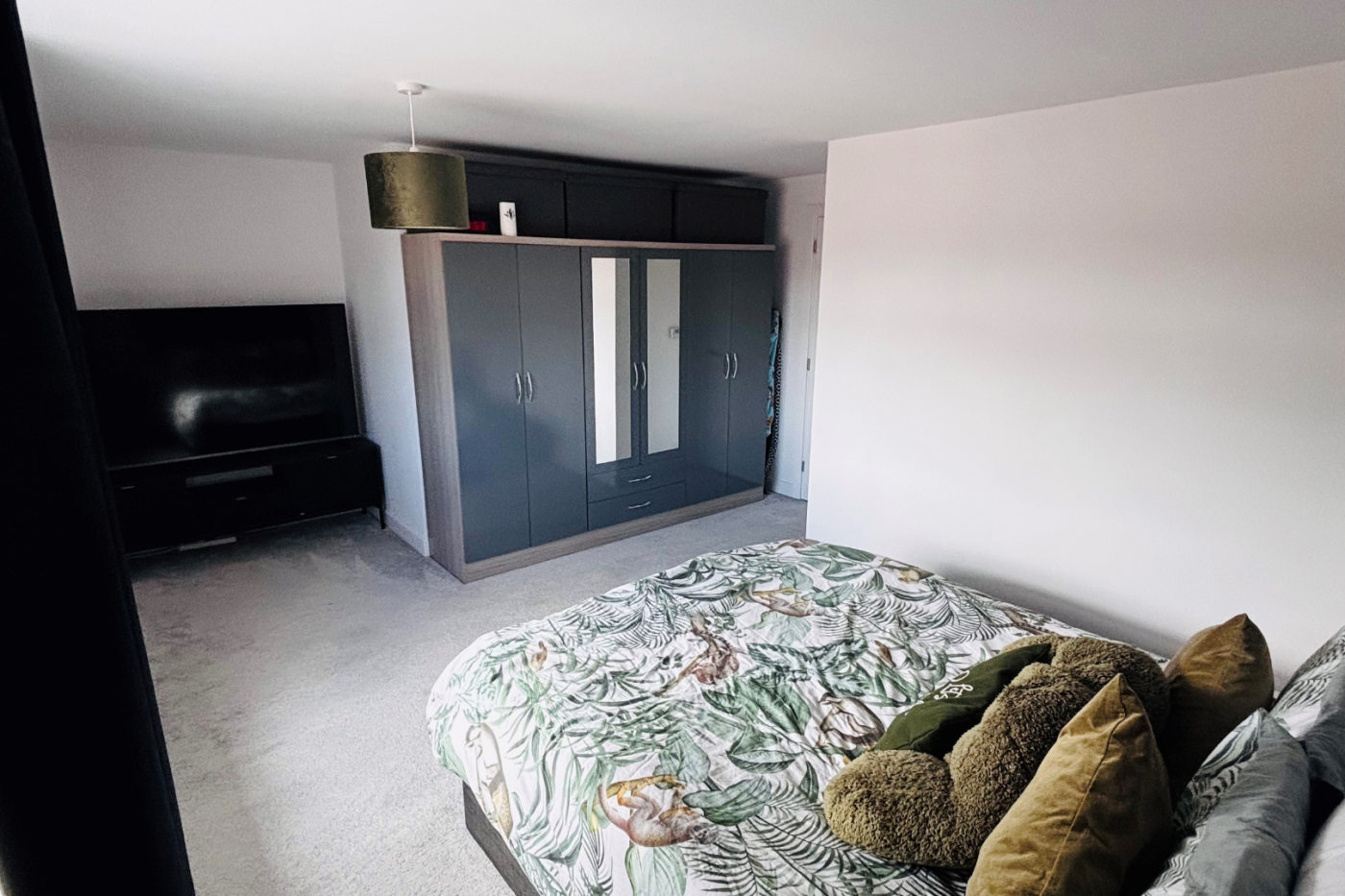 Bedroom with double bed and wardrobe