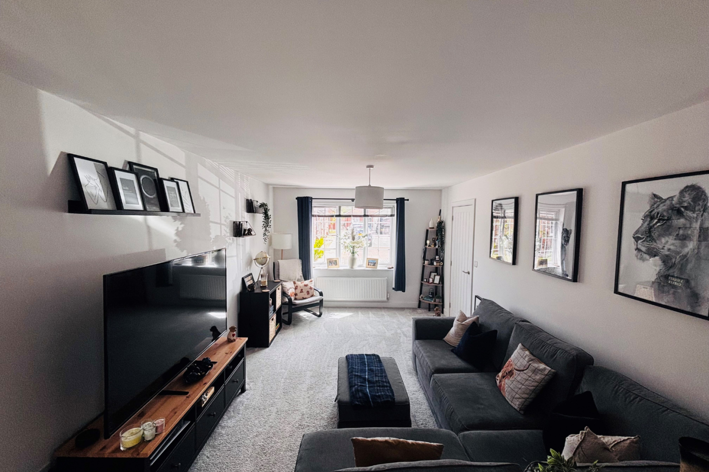 Living room with sofas, TV and cupboards