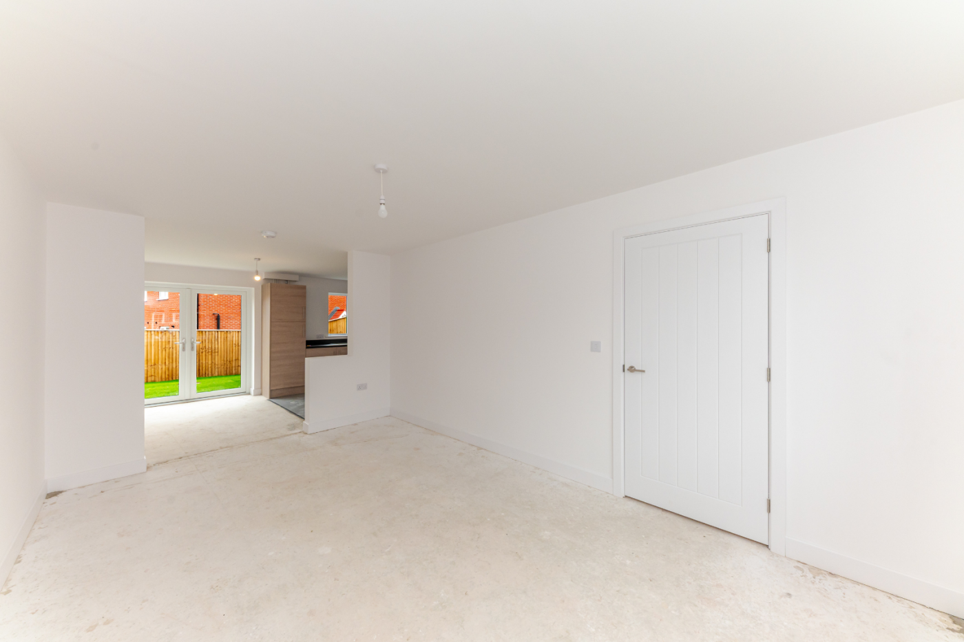 Living room with view into kitchen diner 