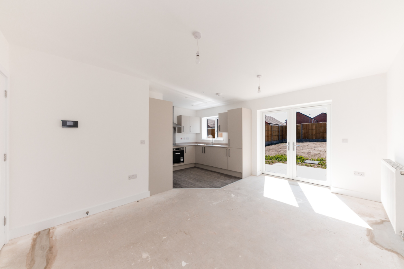 Kitchen, dining and living space with patio doors out into the garden