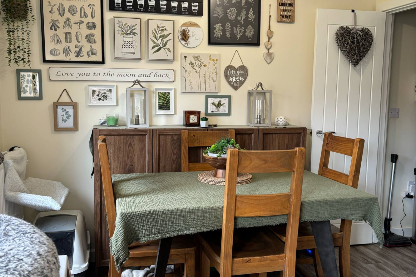 Dining space with table and art on the wall