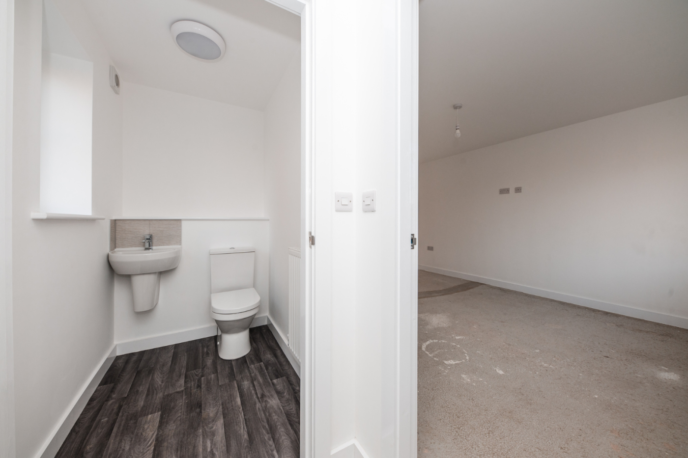 Downstairs WC with a door into the living room