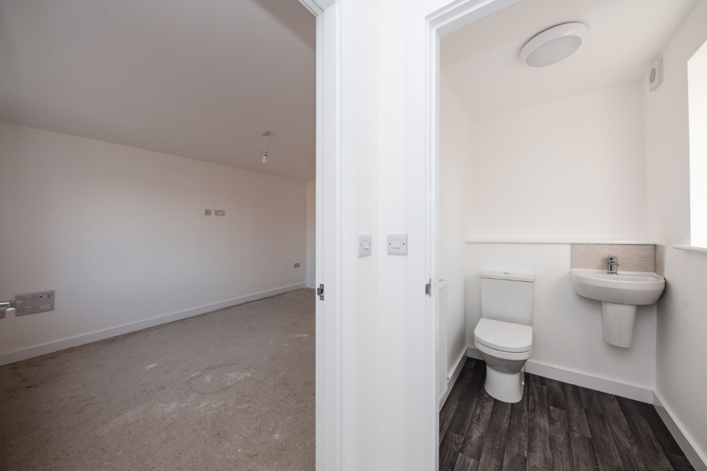 Downstairs WC with a door into the living room
