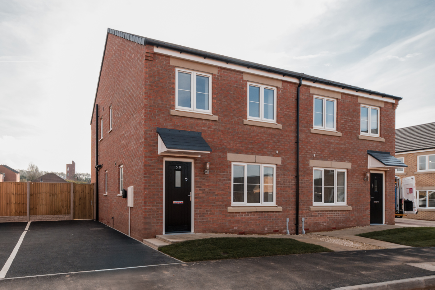 Front of a semi detached house with a driveway