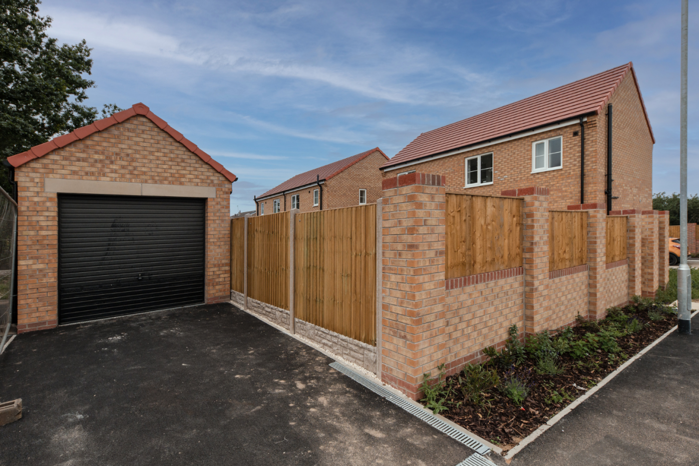 Garage and driveway to rear of home