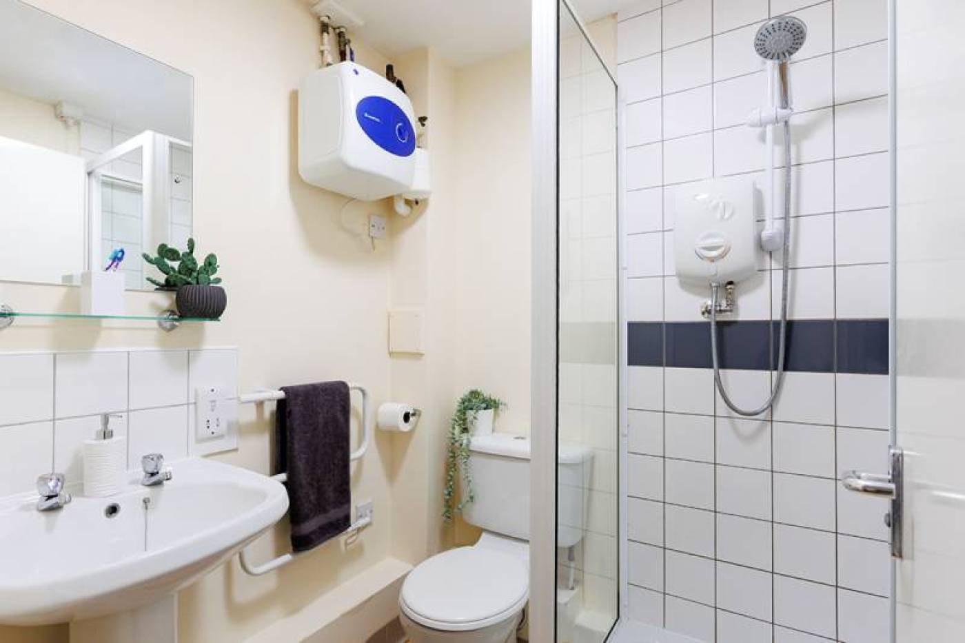 Bathroom with shower, sink and toilet