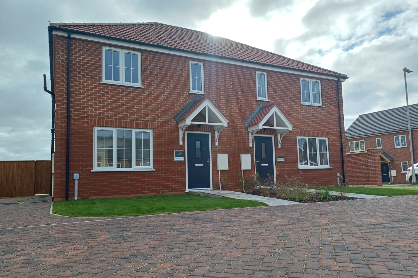 Front of a semi detached house with a driveway