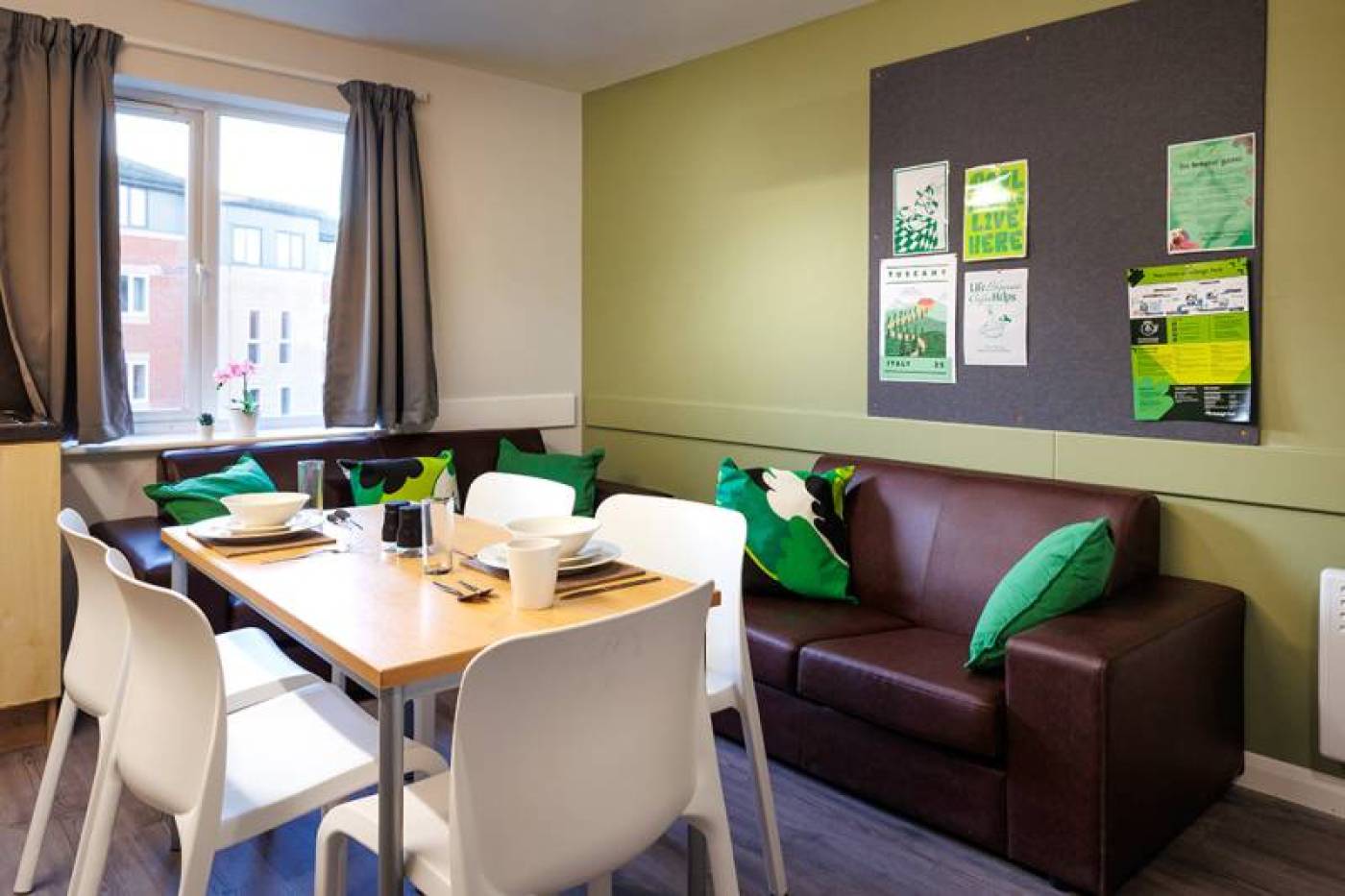 Shared living area with sofas and table with chairs