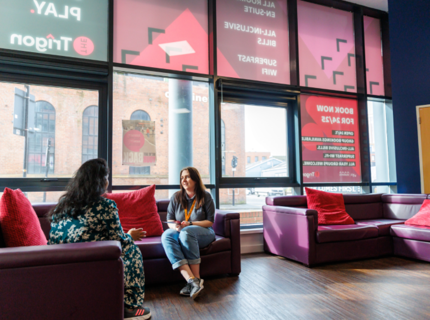 Reception area with two people chatting