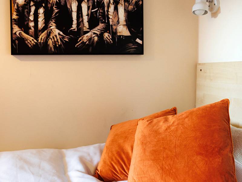 Bedroom with bed, wardrobe, desk and window