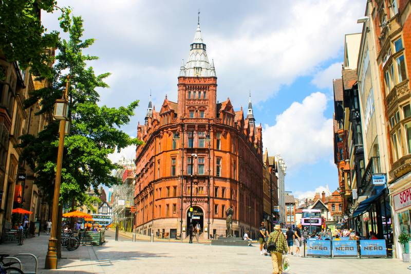 Tram driving through city streets in Nottingham