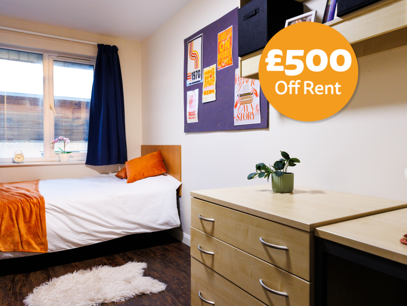 Student bedroom with double bed and desk