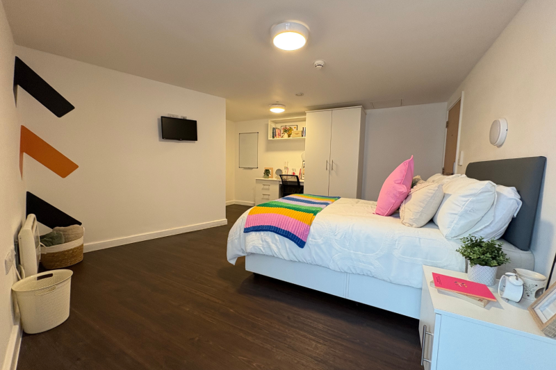 Large student room with bed, desk, wardrobe and ensuite