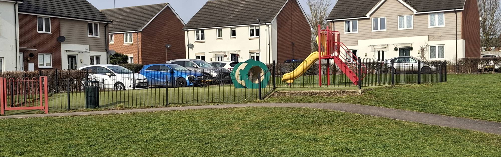 Tamer Road homes with park pictured in front