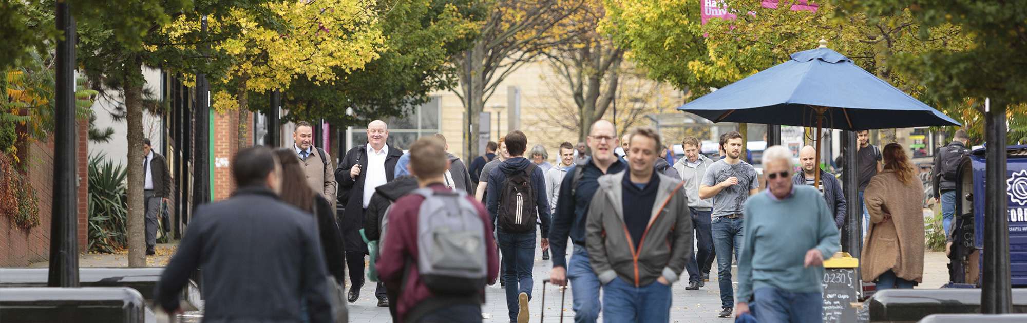 People walking down busy street