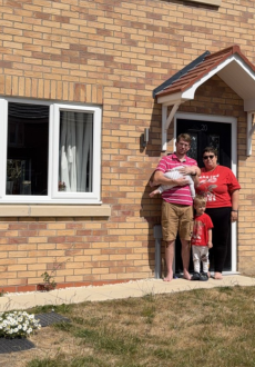 A family outside their shared ownership home bought through Acis Group