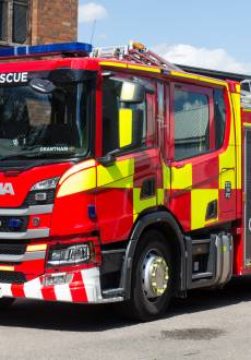 A fire engine leaving the station