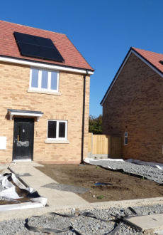 A row of semi detached homes being built