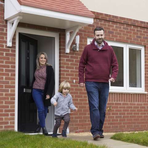 Young family leaving the house