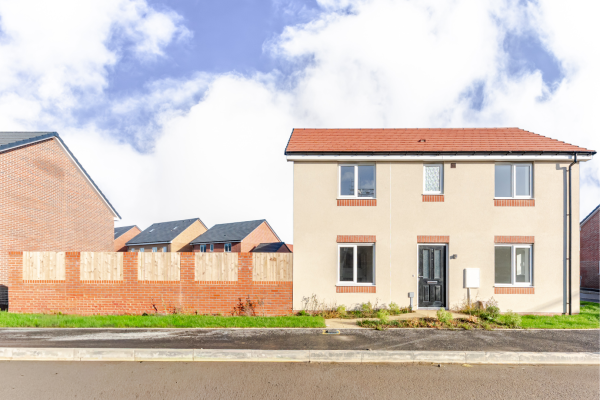 Front of the house showing pavement, doors and window