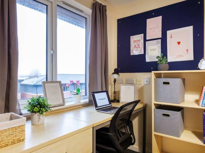 Desk, storage and noticeboard