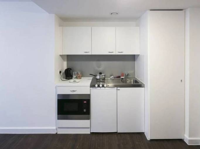 Kitchen with oven, hob and sink