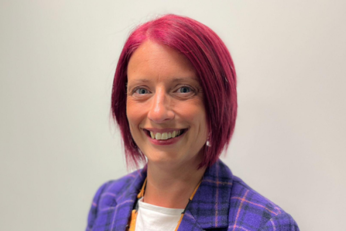 A lady smiling at the camera