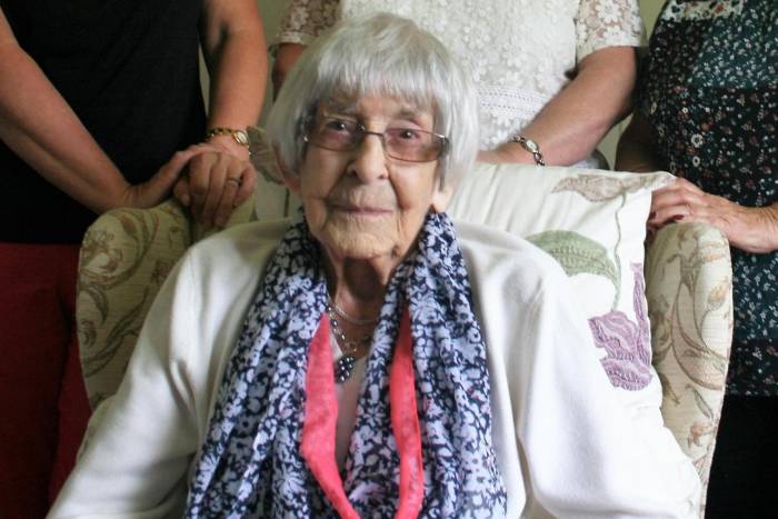 Elderly lady sitting in a chair