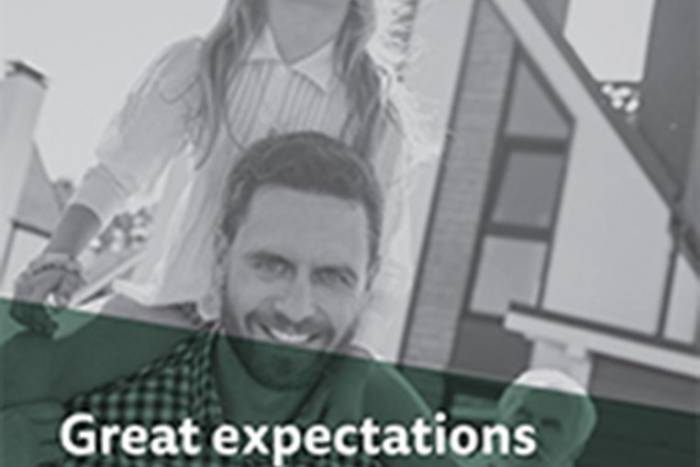 Man with child on his shoulders smiling