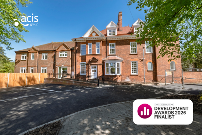 A photo of a large house with Acis Group logo and Inside Housing Development Awards logo