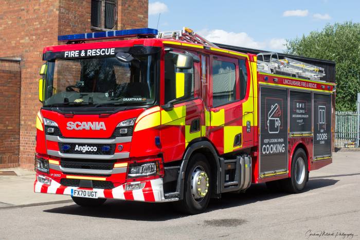 A fire engine leaving the station