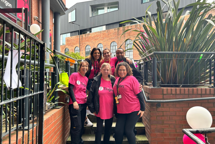 six people in pink tshirts at the trigon move-in event 