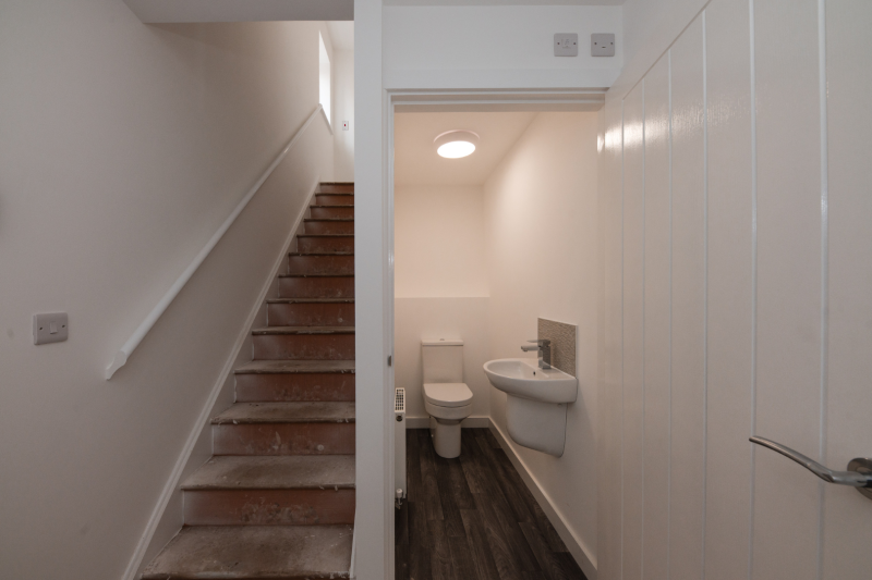 Hallway with stairs and downstairs WC