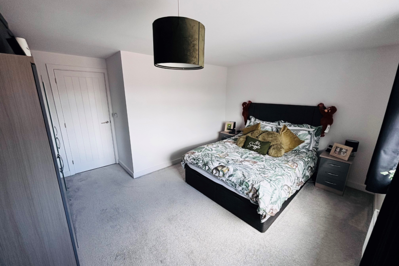 Bedroom with double bed and wardrobe