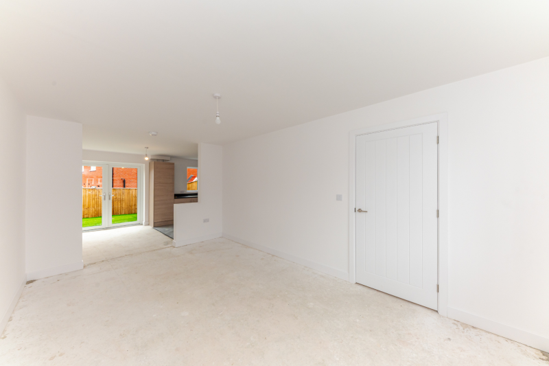 Living room with view into kitchen diner 