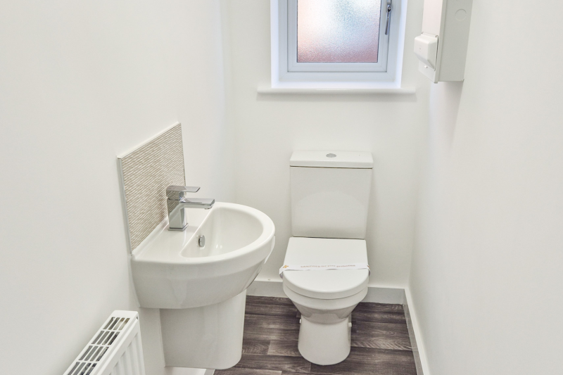 The downstairs toilet showing kitchen and sink