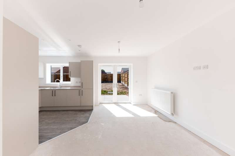 Kitchen, dining and living space with patio doors out into the garden