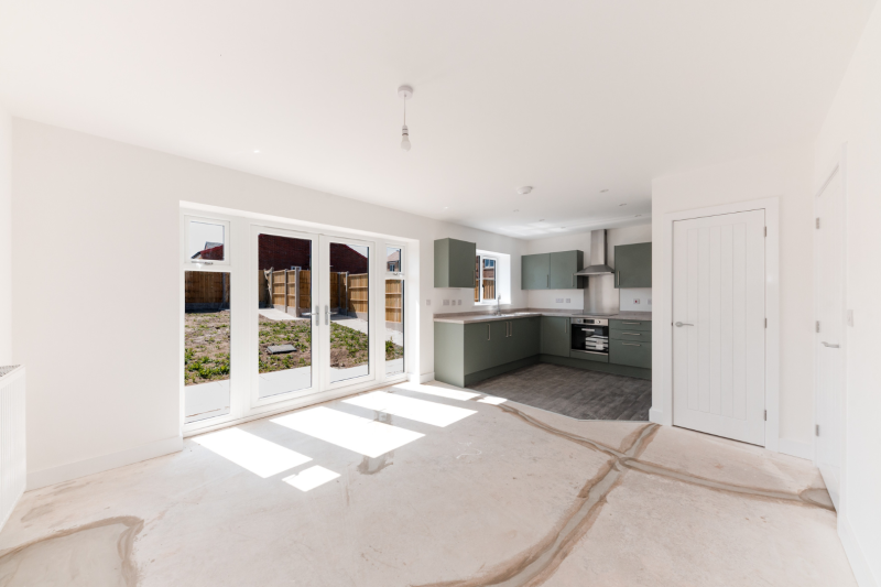 Kitchen, dining and living space with patio doors out into the garden