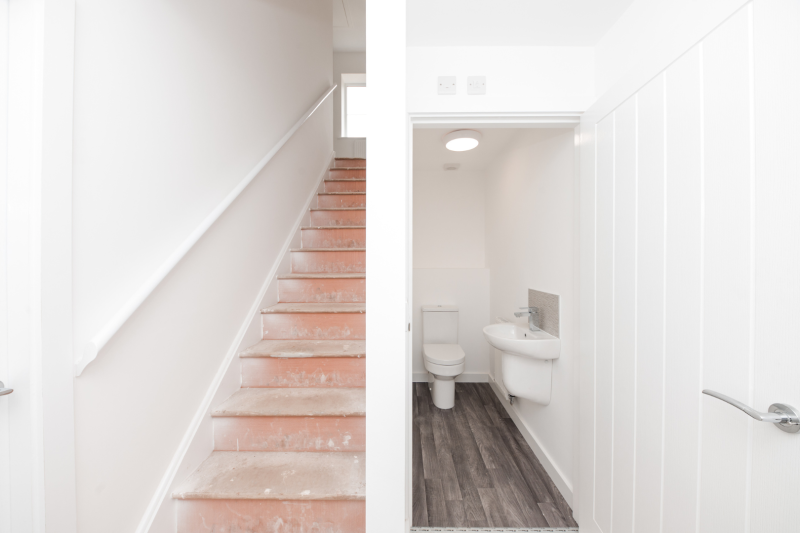 Hallway with stairs and downstairs WC