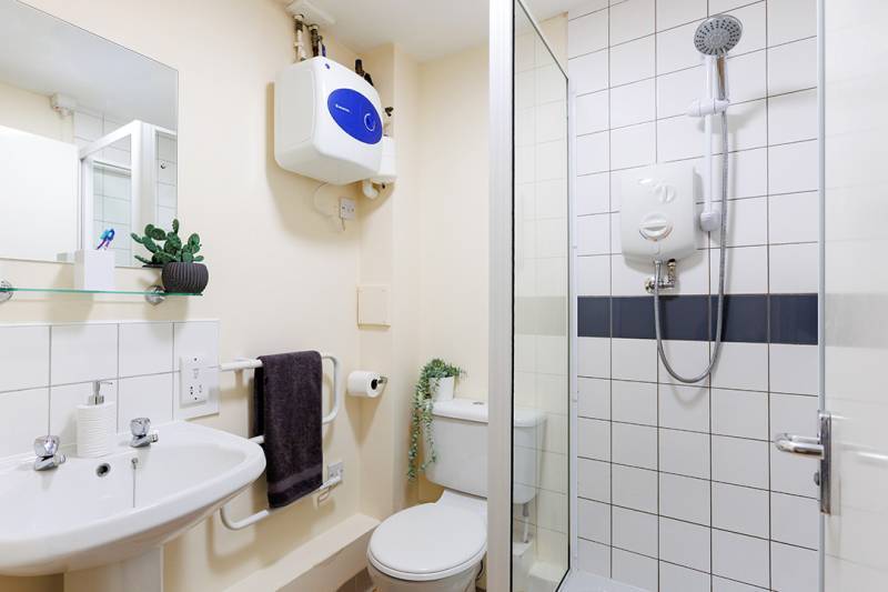 Bathroom with shower, sink and toilet
