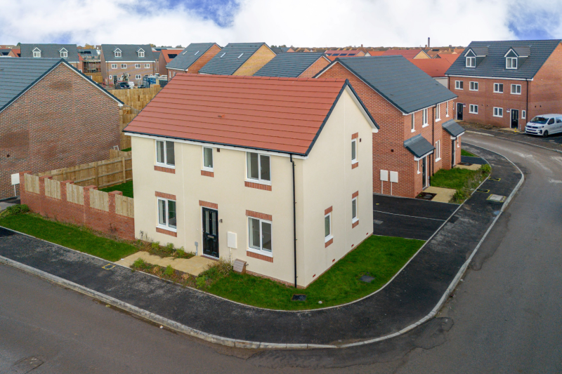 Front of the house showing pavement, doors and window
