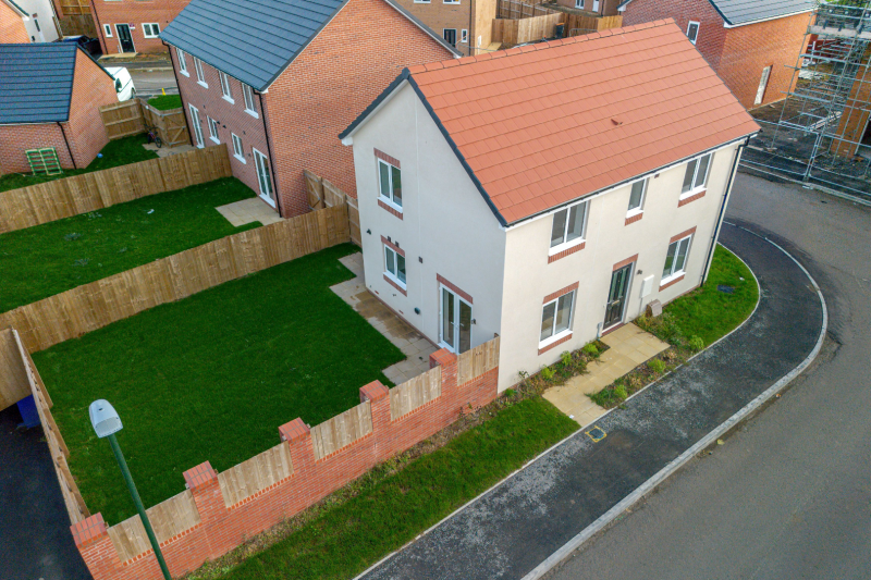 Front of the house showing pavement, doors and window
